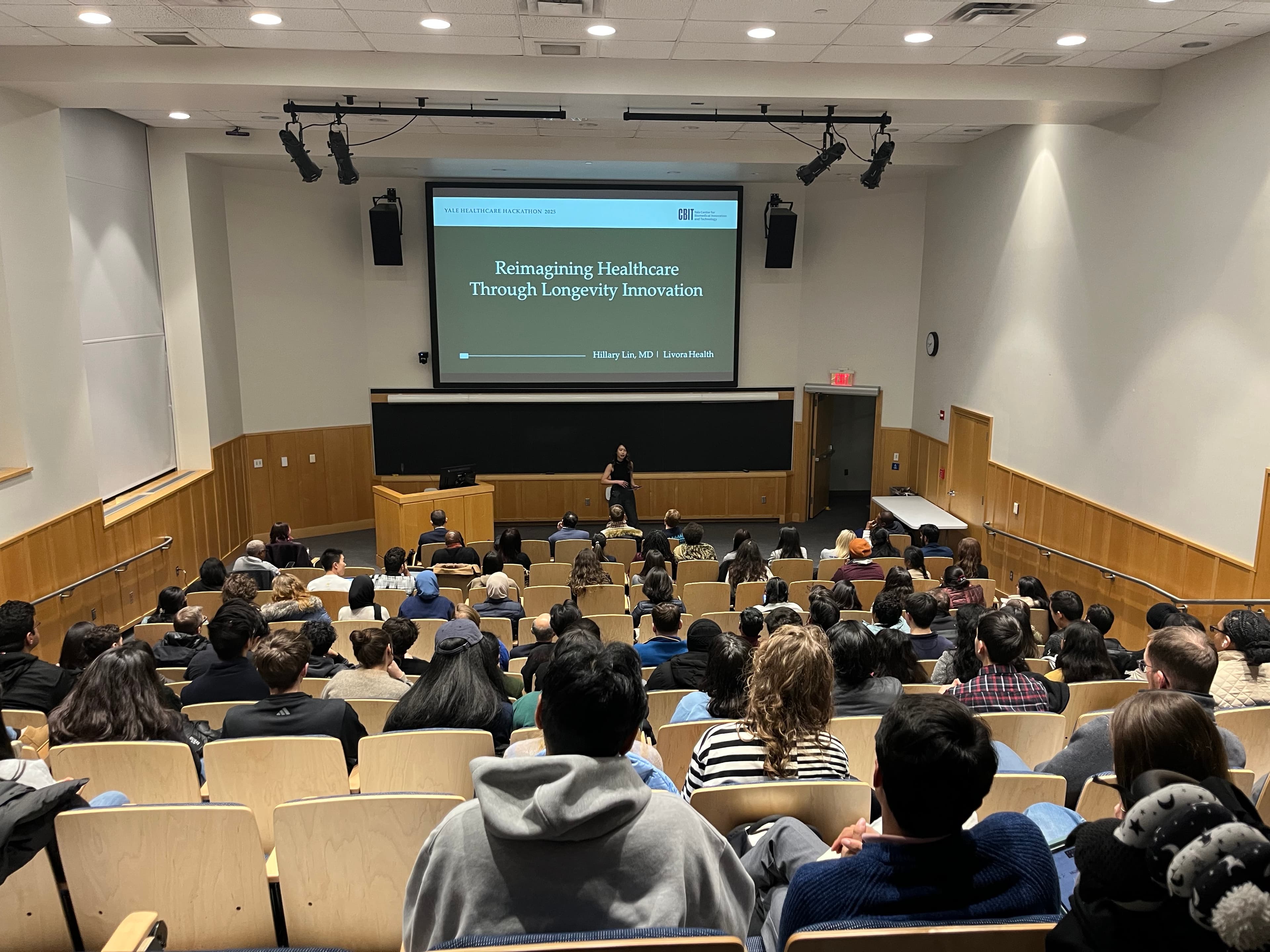 Audience view of Hillary Lin, MD giving a keynote at the Yale Healthcare Hackathon