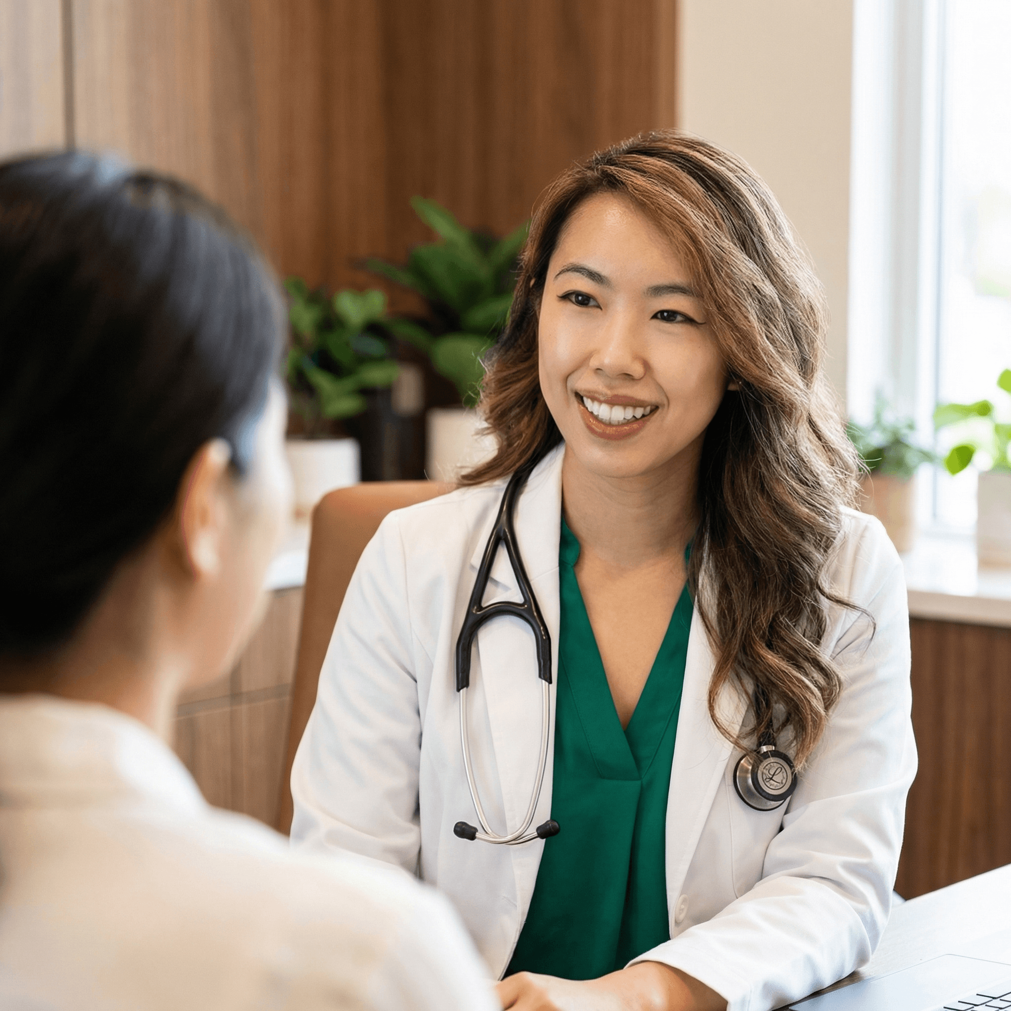Dr. Hillary Lin consulting with a patient