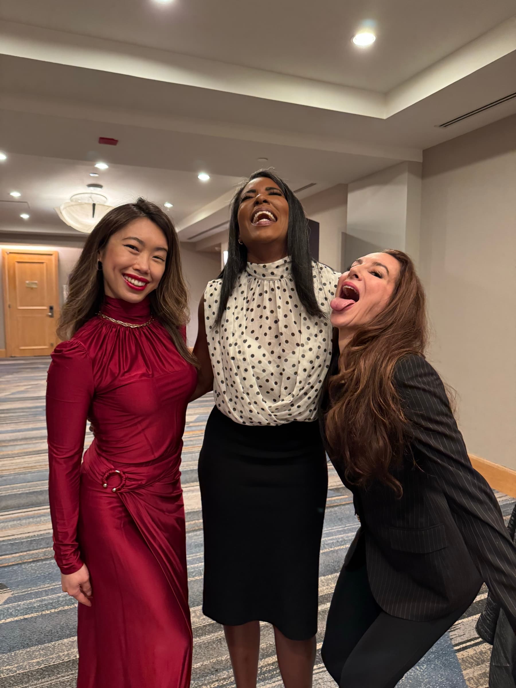 Hillary laughing with other women at Livelong