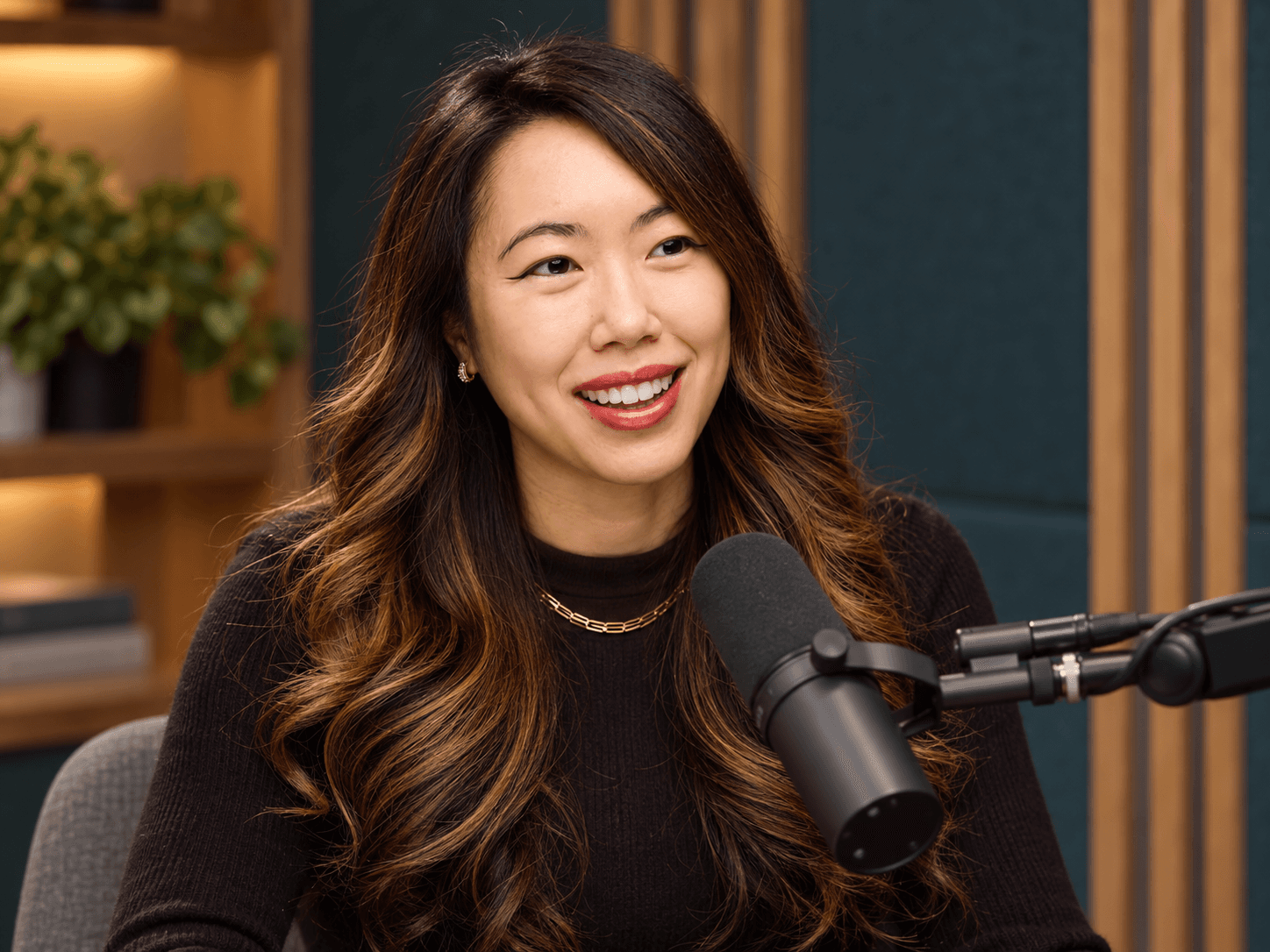 Hillary Lin smiling at a podcast microphone, an approved AI-generated editorial portrait
